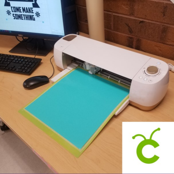 Cricut electronic cutting machine with vinyl sticker loaded for use