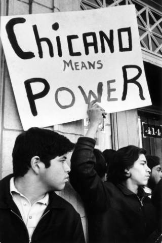 Chicano Means Power sign at protest