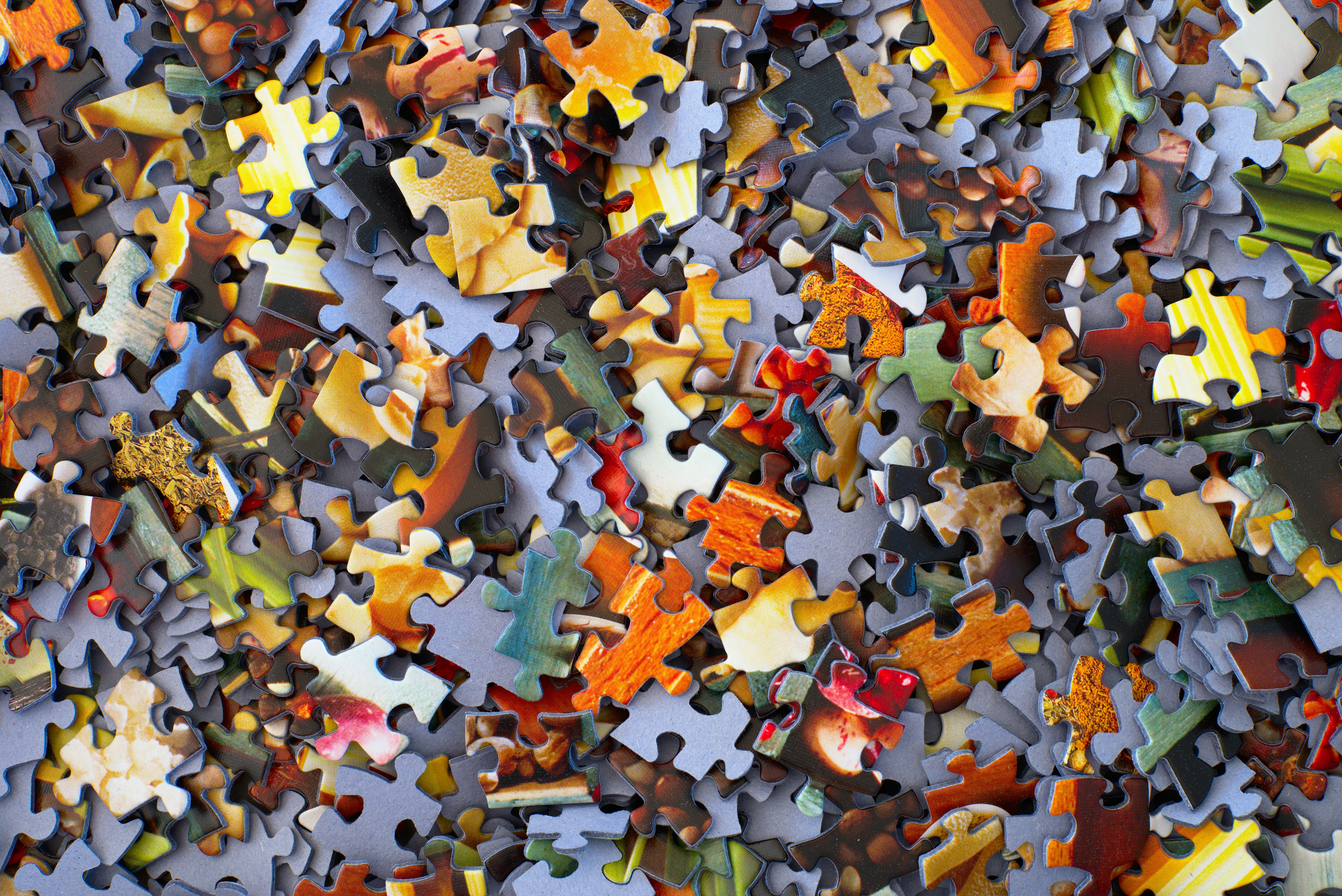 Jigsaw puzzle pieces; image from unsplash.com