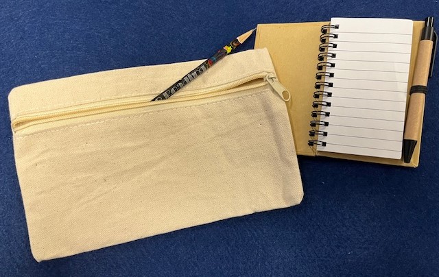 Photo of fabric pencil bag with pencil and mini notebook.