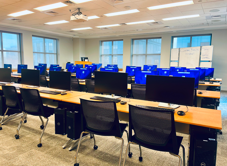 View of the computer class located on the 4th floor at Central Library. Rows of computers.