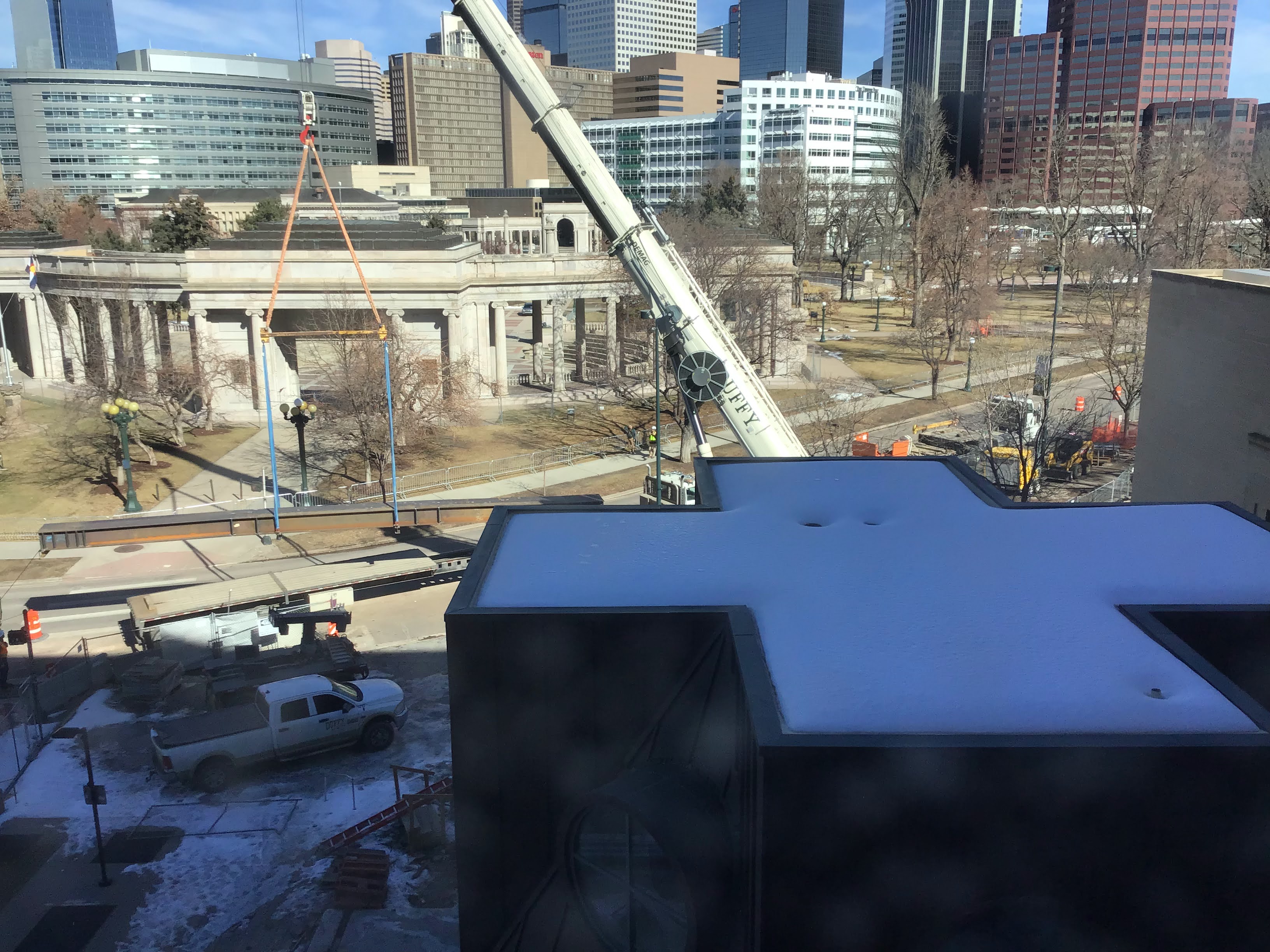 A crane is pictured lifting steel beams into the Central Library