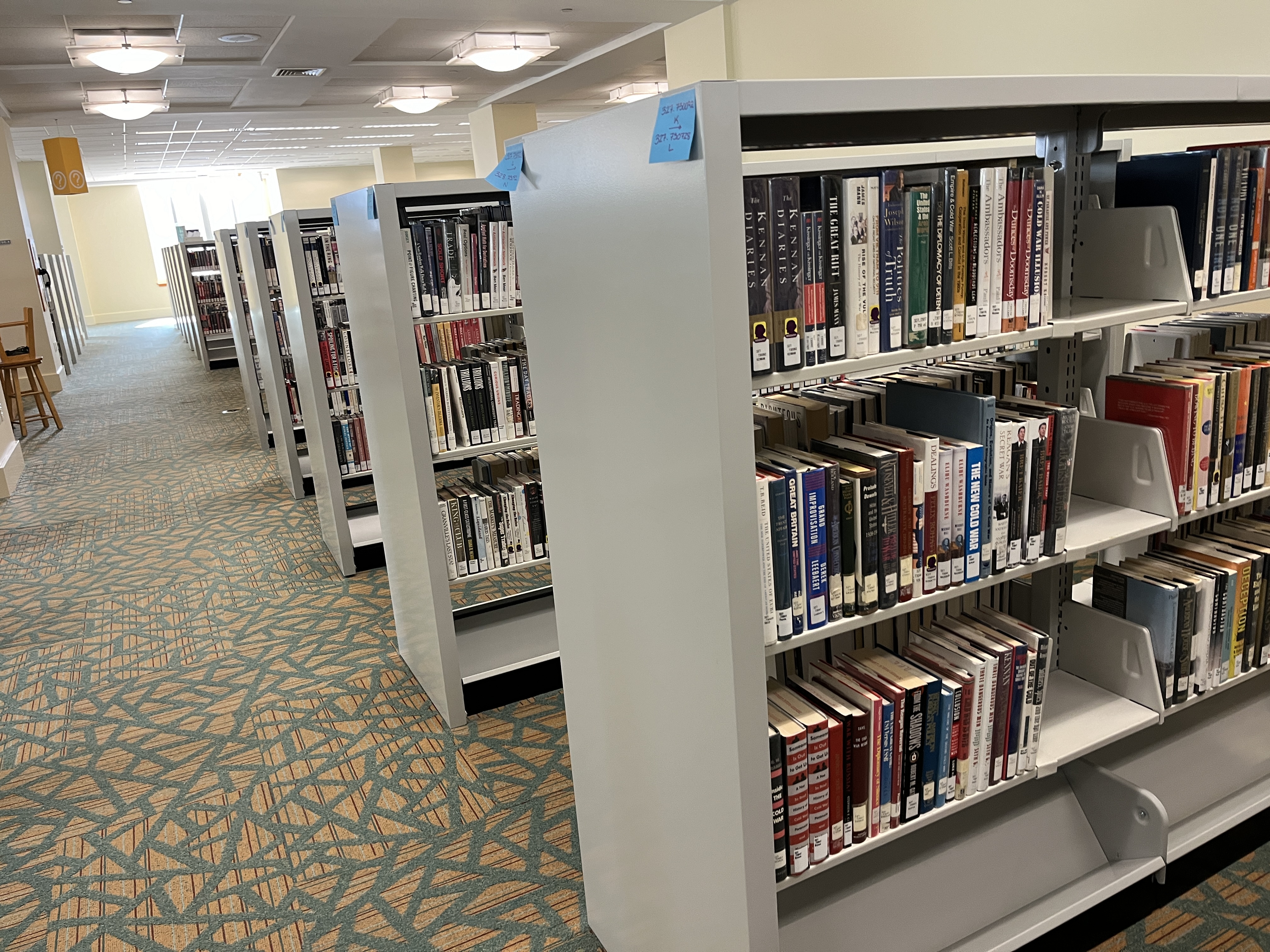 A photos of library books on shelving units.