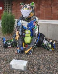 outdoor multicolored bear sculpture made of recycled materials