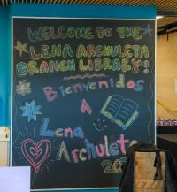 Chalk art welcomes the community to the new Lena Archuleta Branch Library.