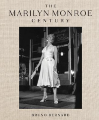 black and white photo of Marilyn Monroe in front of a storefront