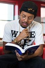 Young person reading a book