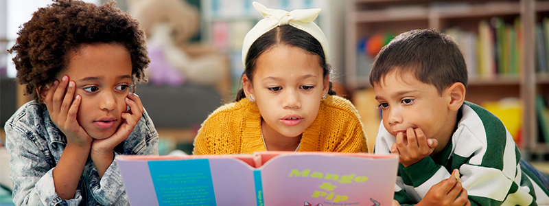 Children reading together in class