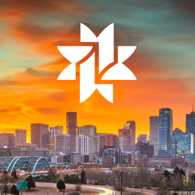 orange dusky sky and white denver public library logo over denver skyline